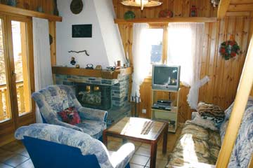 Ferienhaus Les Collons - Wohnzimmer mit offenem Kamin